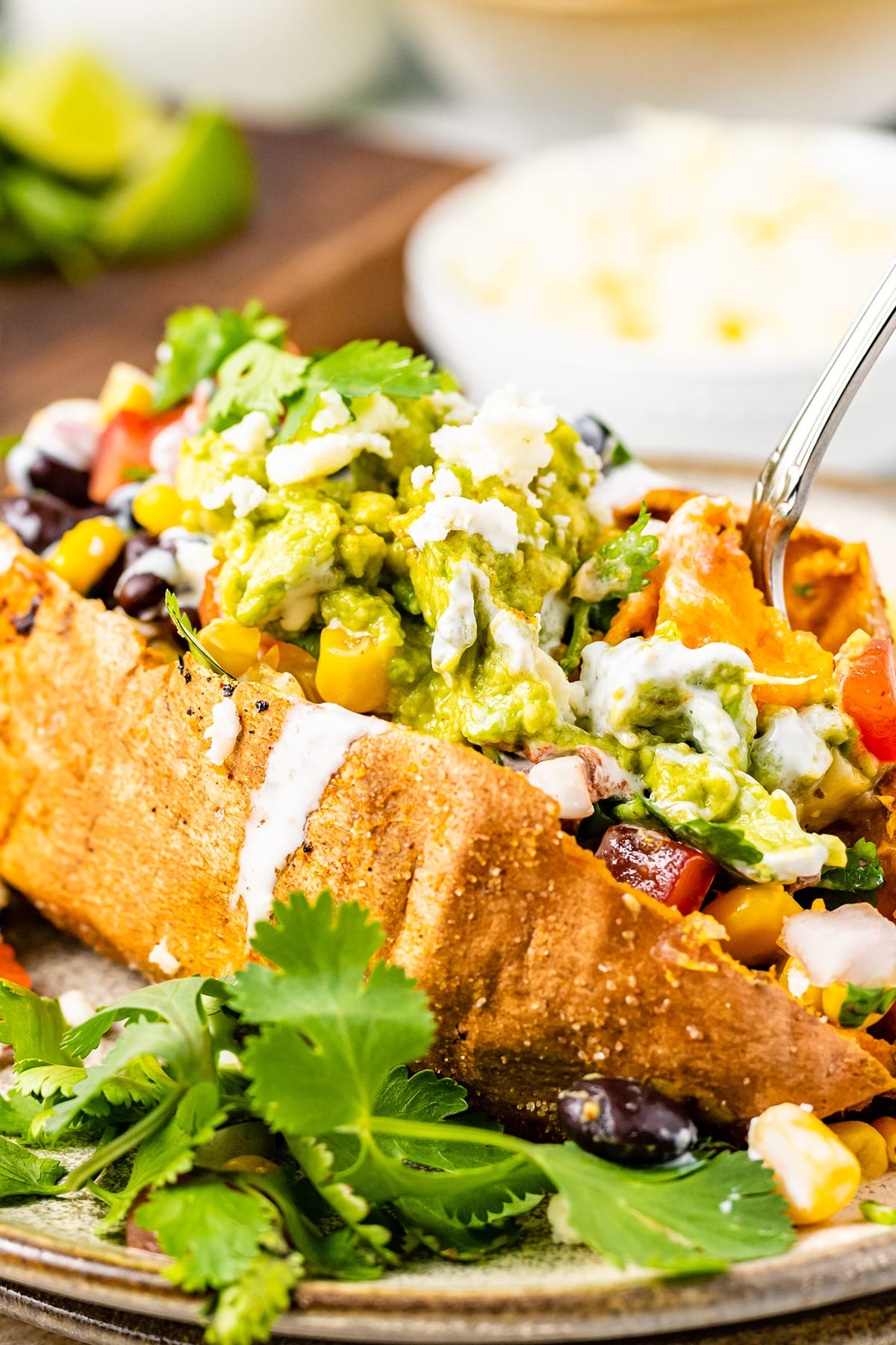 Stuffed baked sweet potatoes with Mexican filling and guacamole