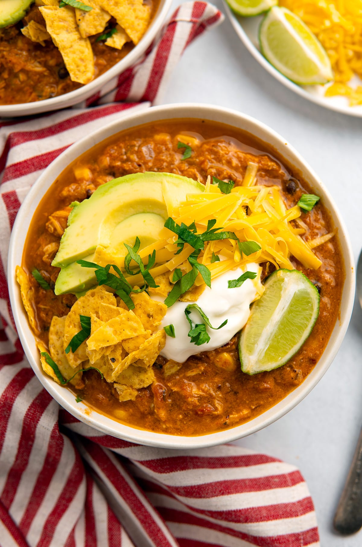 red chicken chili with cream cheese and toppings