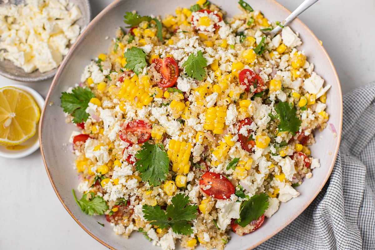 Corn quinoa salad with cherry tomatoes and feta